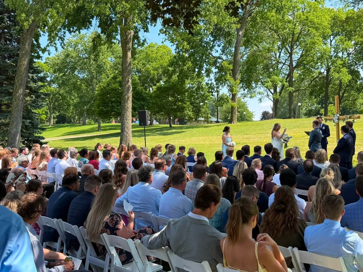 An outdoor ceremony with my speaker set up for the officiant