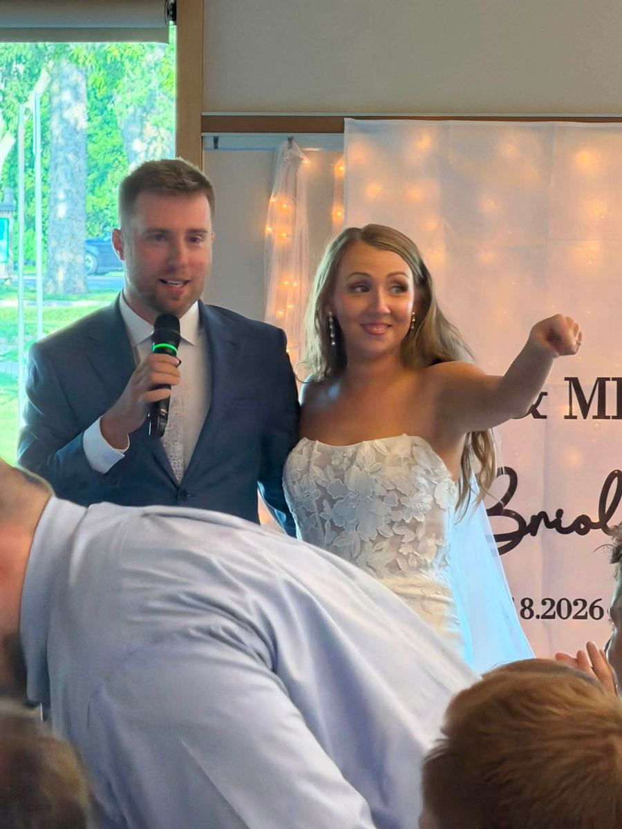 Bride and groom on the mic